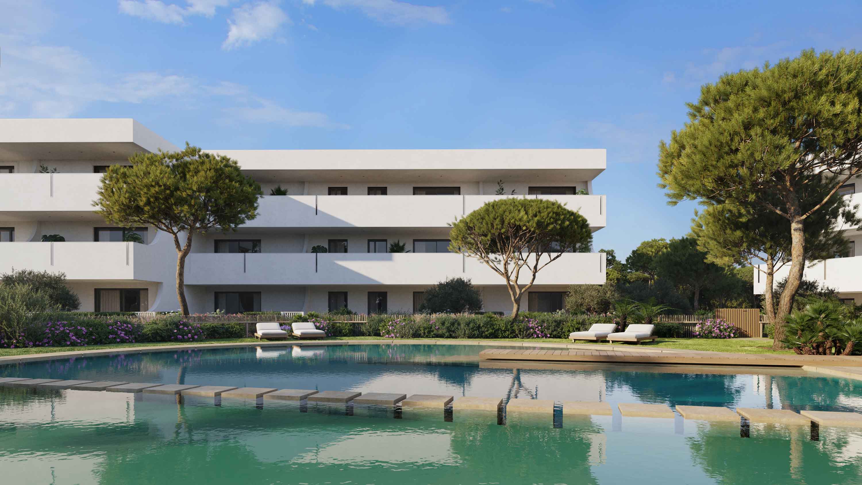 Buitenaanzicht van het wooncomplex met zwembad en mediterrane tuinen